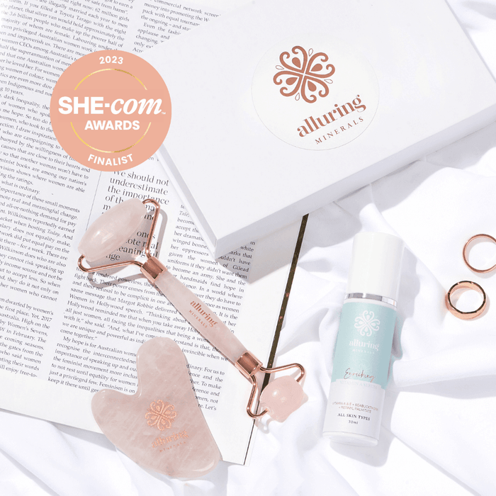 Alluring Minerals Enriching Vitamin A Serum styled with a rose quartz roller, gua sha and SHE.com Awards finalist badge