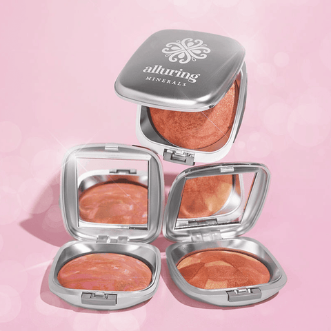 Three open Alluring Minerals Mineral Baked Blush compacts showing different swirled shades
